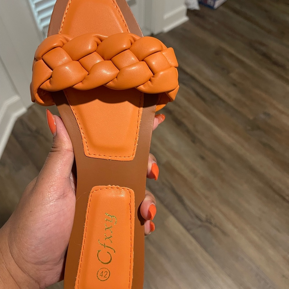 Flat braided leather sandals